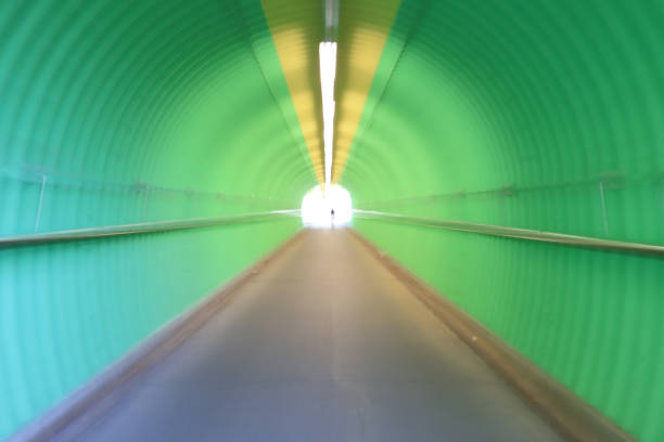 istock deep of green color tunnel horror feel 909846456
