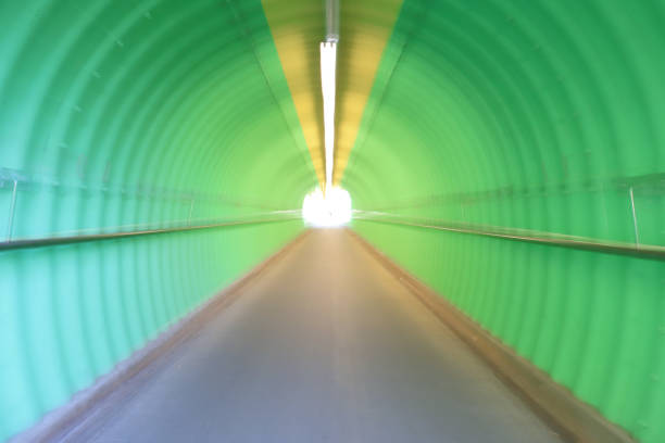 istock deep of green color tunnel horror feel 909846478