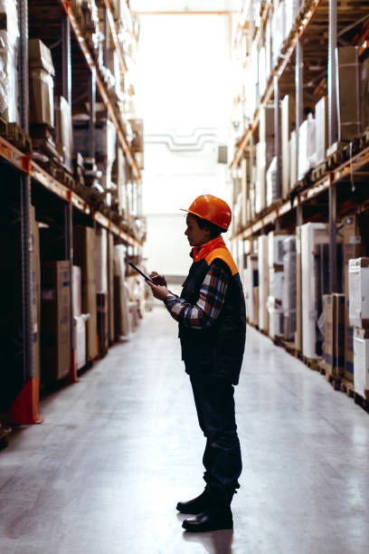 istock Woman worker in warehouse 909846936