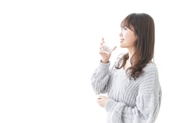 istock Woman drinking water 909850212