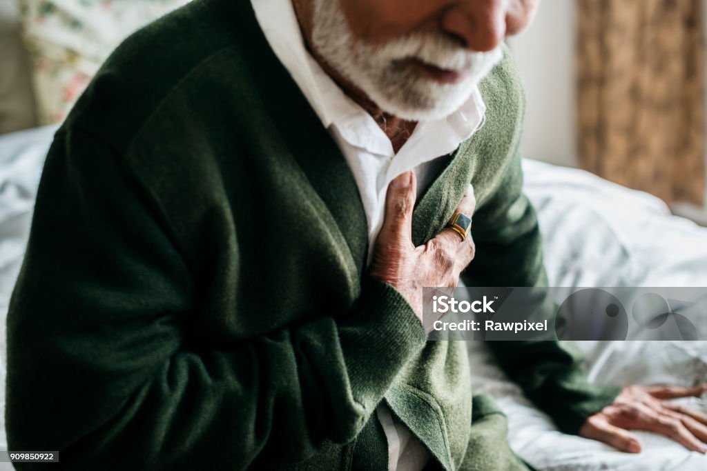 An elderly Indian man with heart problems Heart Attack Stock Photo