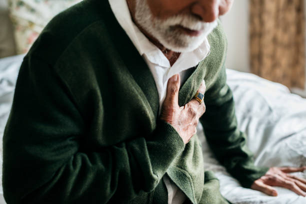 an elderly indian man with heart problems - chest pain imagens e fotografias de stock