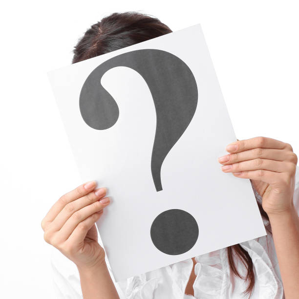 istock closeup.young woman showing a question mark 909851418
