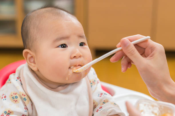 istock Baby eating a weaning food 909855358