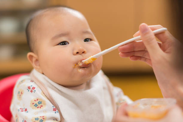 istock Baby eating a weaning food 909855376