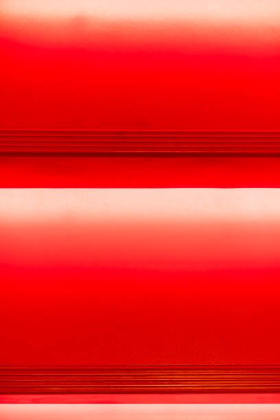 istock Abstract modern red stairs with warm light  - stairway composition 909857764
