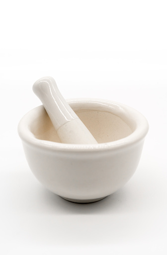 Mini white mortar and pestle porcelain for medicine grinder isolated on white background