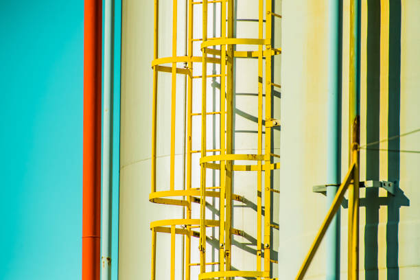 istock Stairs in an industrial area. Create geometric pattern with sunset. 909861898