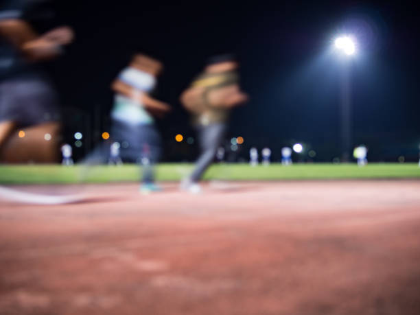 abstract blur background of running track and soccer field, at night. - sports track track and field stadium sport night imagens e fotografias de stock