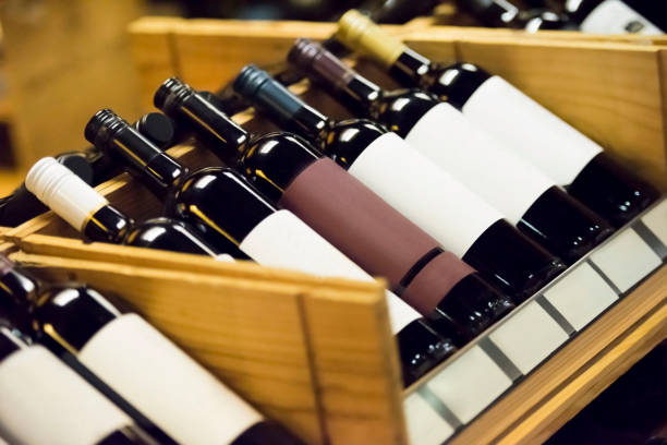 istock Wine bottles on the wine rack 909867750