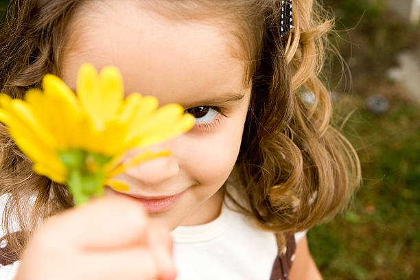 istock Girl holding a flower 90986943