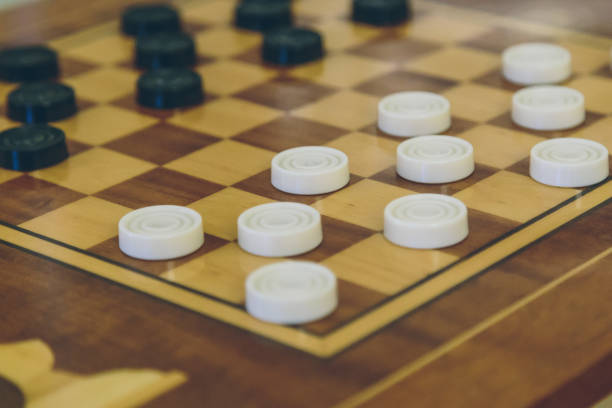 istock Vintage wooden chess on the chess board closeup 909870310