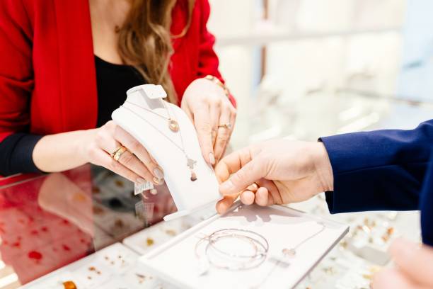 istock Man buying gift in jewelry store. 909878378