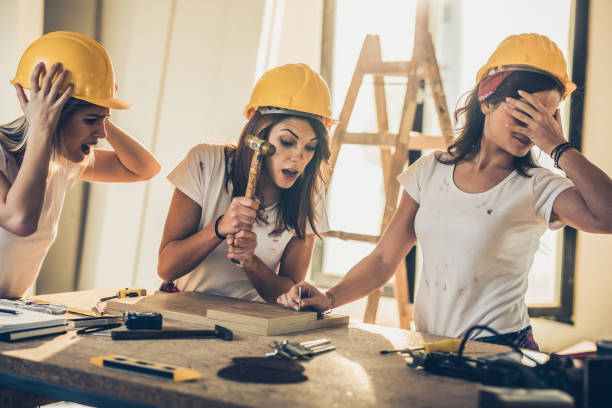 istock Be careful, you will hit her finger with that hammer! 909886972