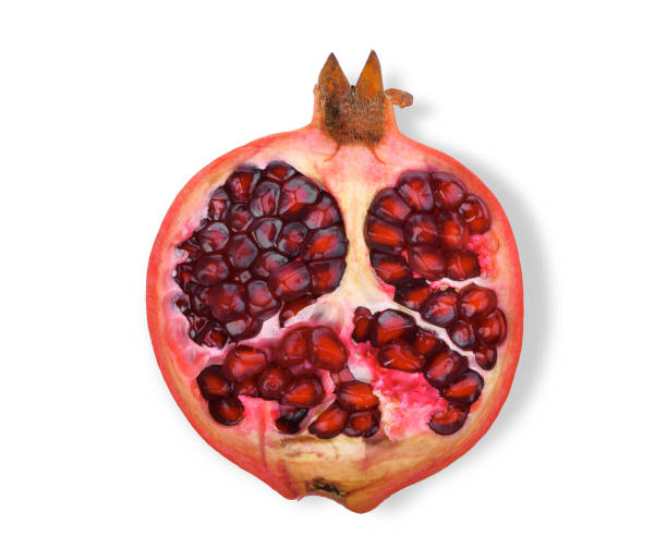 istock hafl pomegranate fruit with seeds isolated on white background, flat lay, top view 909887192