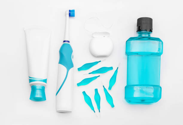 istock Tools for dental care: orthodontic brush, floss, toothpaste. Invisible dental aligners modern tooth brackets transparent braces to straighten teeth in cosmetic dentistry and orthodontics 909887428