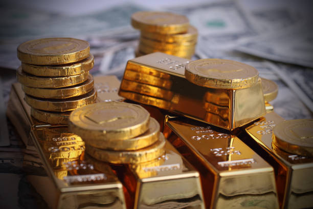 istock Gold coins with gold ingot 909890920