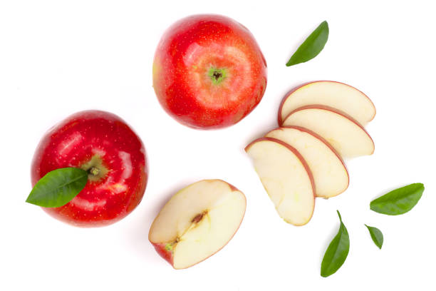 istock red apples with slices and leaves isolated on white background top view. Set or collection. Flat lay pattern 909891622