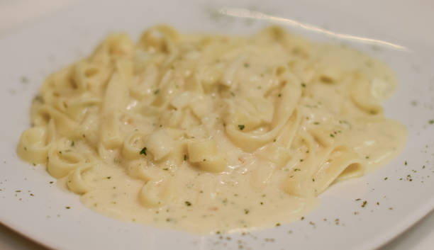 istock Pasta with cream cheese sauce 909895524