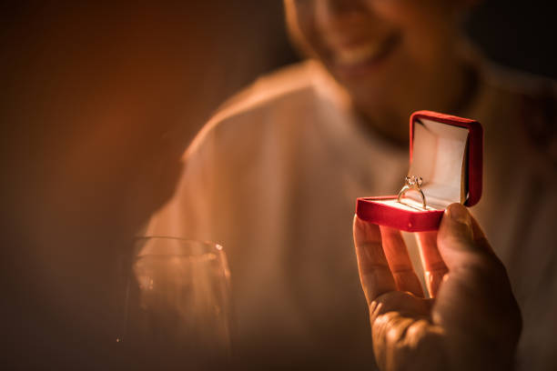 istock Close up of unrecognizable man proposing to his girlfriend. 909898948