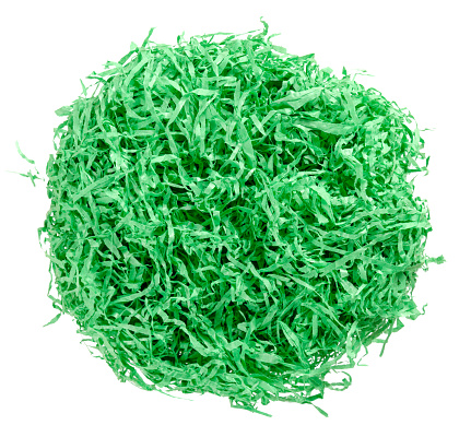 Green paper Easter grass nest from above. Colored crinkle grass. Gift basket shred and filler. Decoration.