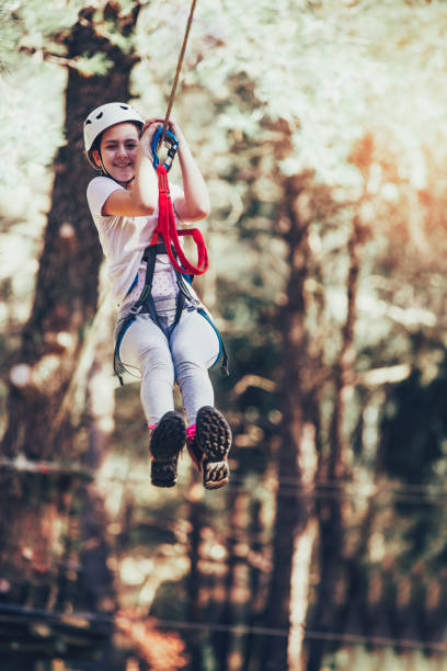 istock Girl in adventure park 909899588