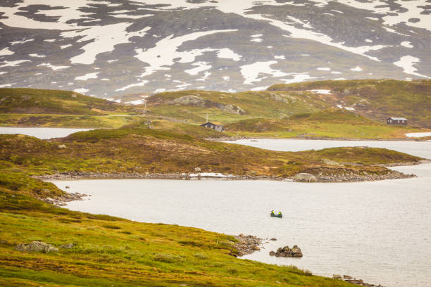 istock People canoeing in lake 909902446