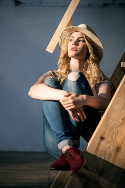 istock Young woman with straw hat 909903662