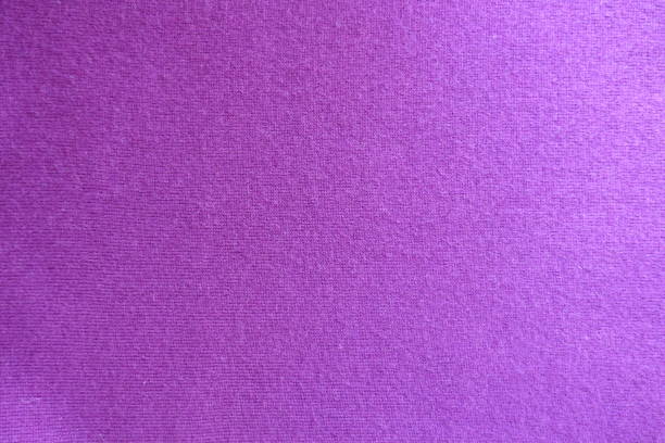 Surface of fuchsia colored knitted fabric from above Surface of fuchsia colored knitted fabric from above unprinted stock pictures, royalty-free photos & images