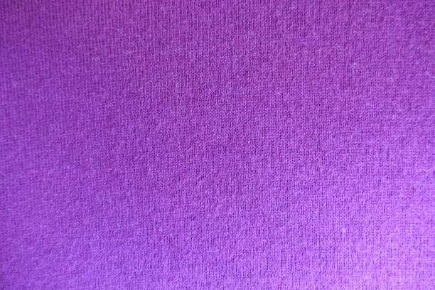 istock Texture of fuchsia colored knitted fabric from above 909909096