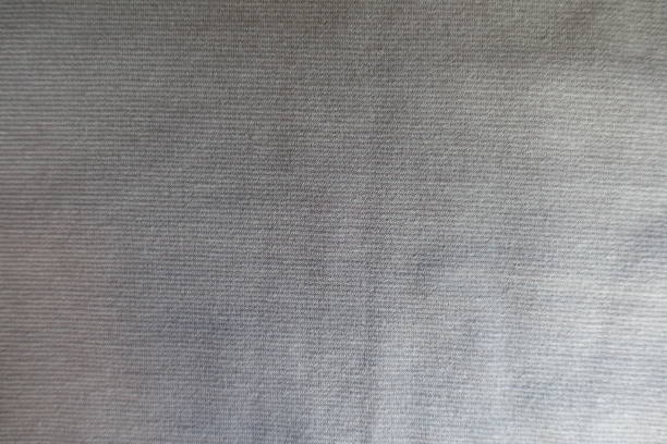 istock Top view of light grey jersey fabric 909909224