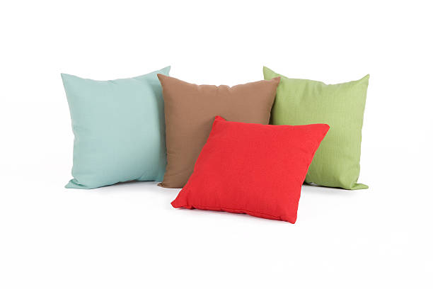 Four different colored pillows Throw Pillows shot on white with clipping path pillow stock pictures, royalty-free photos & images