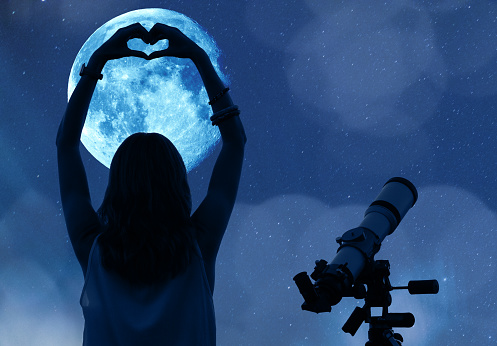 Girl holding a heart - shape with telescope, Moon and stars. My astronomy work.