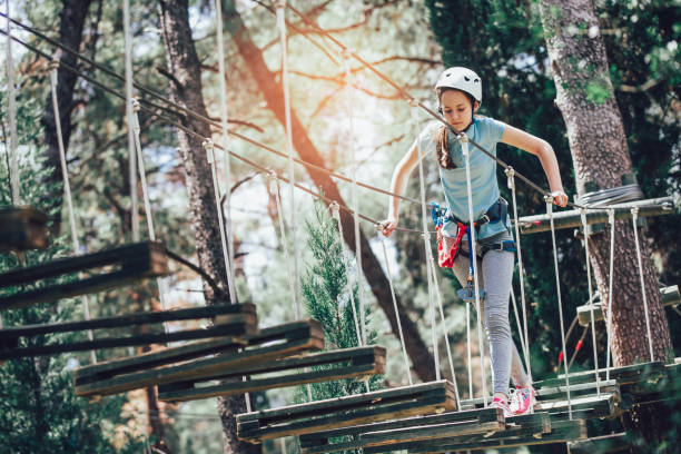 istock Girl in adventure park 909915326