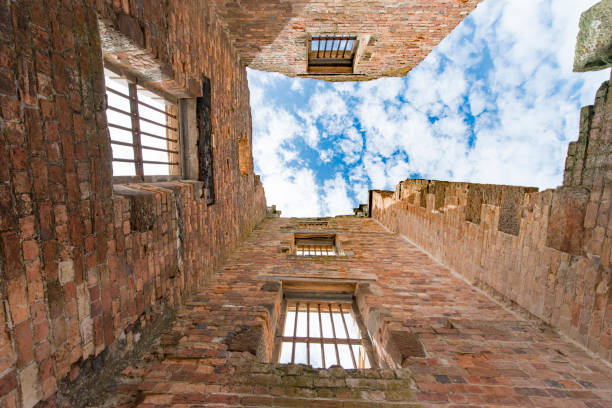 The old abandoned prison town of Port Arthur, is located on the Tasmanian Peninsula, Tasmania, Australia. This image shows the wall and some windows of the main prison building.