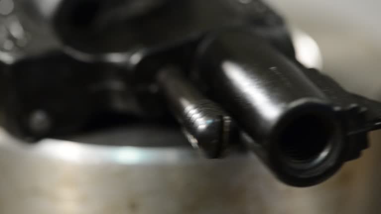 detail of handgun, panning