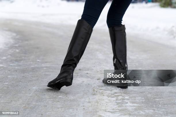 Woman Slips On Slippery Road Covered With Ice Concept Of Injury Risk In Winter Stock Photo - Download Image Now