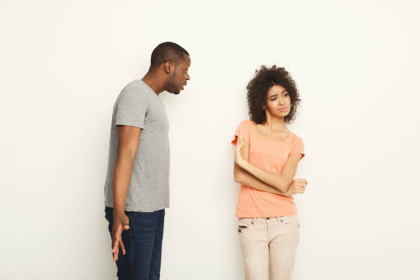 istock Break up, angry couple shouting at each other 909918446