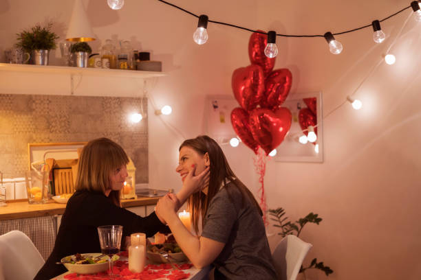istock Lesbian couple celebrating Valentine's day 909918780