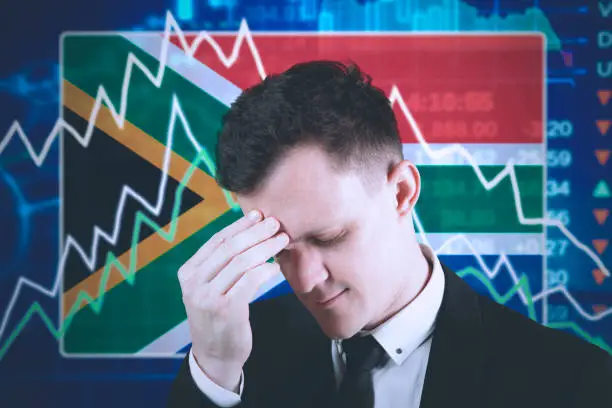 Picture of Caucasian businessman looks stressed with declining finance graph in the trade stock