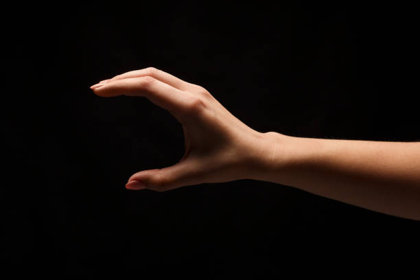 istock Female hand measuring something, cutout, gesture 909927486