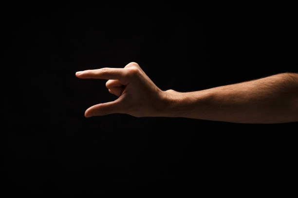 istock Male hand measuring something, cutout, gesture 909927972