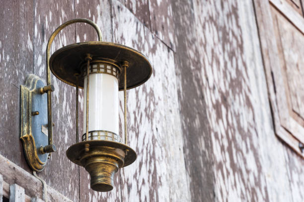 istock ancient lantern on the wooden wall vintage 909930772