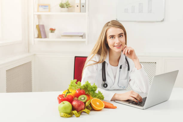 istock Female nutritionist working on laptop 909931940