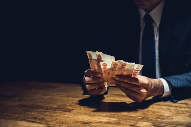 istock Businessman counting money, Russian ruble currency 909931984