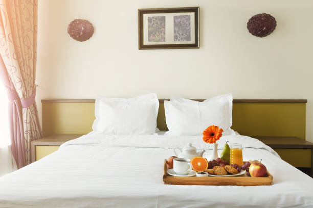 istock Breakfast served in bed on wooden tray 909932130