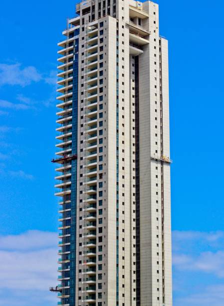 istock Modern apartment highrise building in construction 909932196