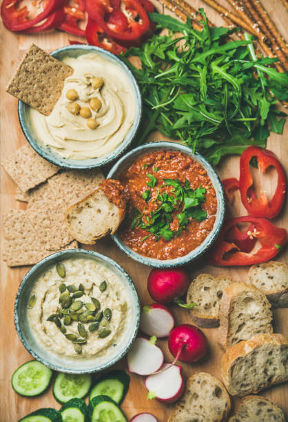 istock Vegan snack board. Flat-lay of Vegetarian dips hummus, babaganush, muhammara 909932448