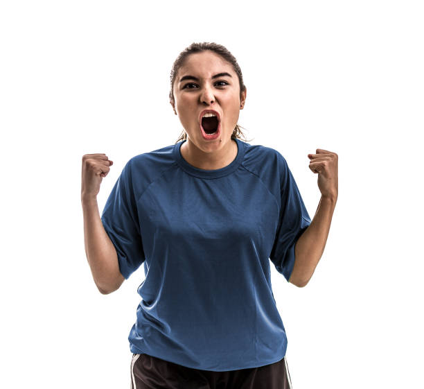 istock Female athlete / fan on blue uniform celebrating on white background 909932512