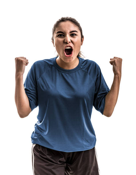 istock Female athlete / fan on blue uniform celebrating on white background 909932532